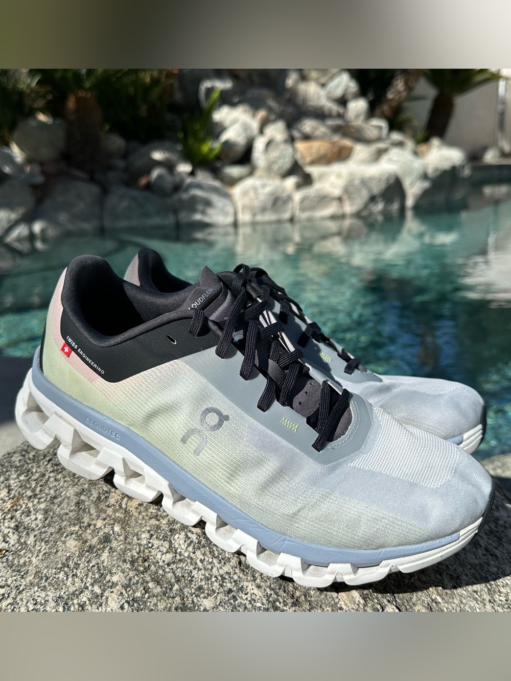 On Cloudflow 4 Running Shoes in Pale Blue and Black
